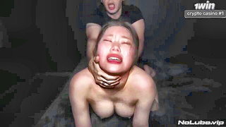 Couple on a made bed in an explicit scene