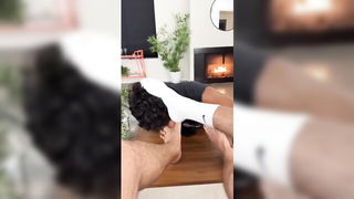 Explicit massage scene in a softly lit room