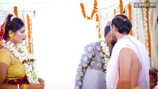 Couple mid-scene in a dim bedroom