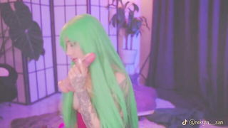 Explicit massage scene in a softly lit room