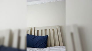 Explicit massage scene in a softly lit room