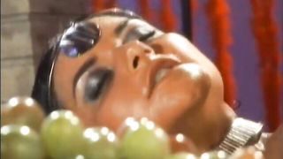 Explicit massage scene in a softly lit room