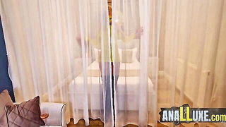 Amateur couple on a living room sofa in explicit scene