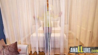 Amateur couple on a living room sofa in explicit scene