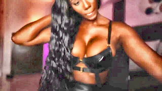 Explicit massage scene in a softly lit room