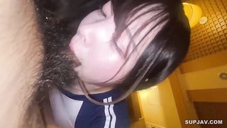 Couple on a made bed in an explicit scene