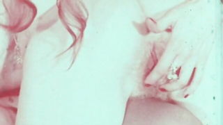 Explicit massage scene in a softly lit room