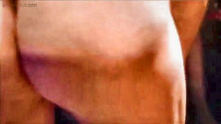 Explicit massage scene in a softly lit room