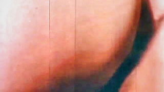 Explicit doggy style scene on a wide bed