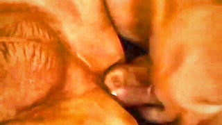 Amateur couple on a living room sofa in explicit scene