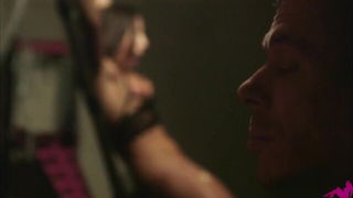 Explicit massage scene in a softly lit room