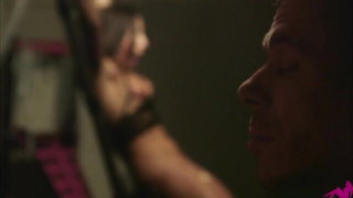 Explicit massage scene in a softly lit room