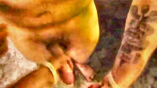 Explicit massage scene in a softly lit room