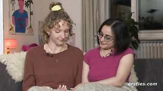 Couple on a made bed in an explicit scene