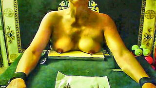Amateur couple on a living room sofa in explicit scene