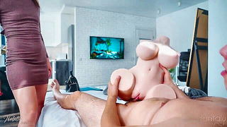 Explicit massage scene in a softly lit room