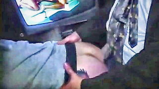 Explicit massage scene in a softly lit room