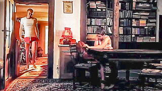 Explicit massage scene in a softly lit room