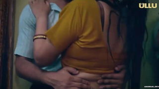 Amateur couple on a living room sofa in explicit scene