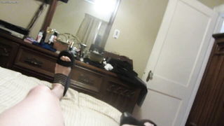 Explicit massage scene in a softly lit room
