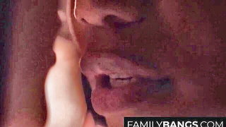Couple on a made bed in an explicit scene