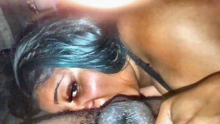Couple on a made bed in an explicit scene
