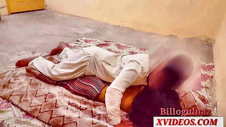 Couple on a made bed in an explicit scene