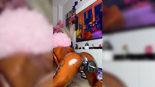 Explicit massage scene in a softly lit room