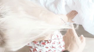 Explicit massage scene in a softly lit room