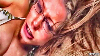 Explicit massage scene in a softly lit room