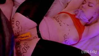 Solo performer with a toy on rumpled bedsheets