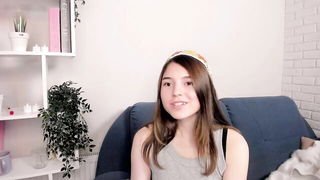 Explicit massage scene in a softly lit room