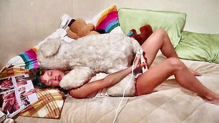 Explicit massage scene in a softly lit room