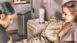Couple on a patterned bedspread in an explicit scene