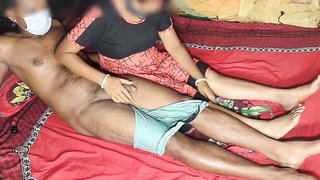 Couple on a made bed in an explicit scene
