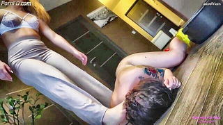 Couple mid-scene in a dim bedroom