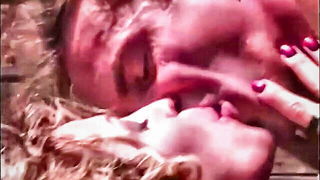 Couple mid-scene in a dim bedroom
