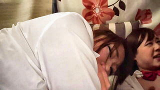 Explicit massage scene in a softly lit room