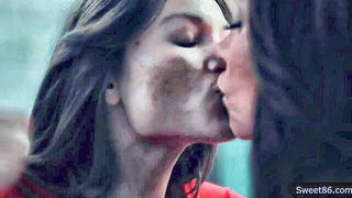 Couple on a made bed in an explicit scene