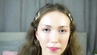 Explicit massage scene in a softly lit room
