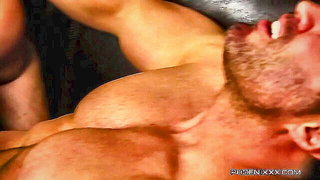 Amateur couple on a living room sofa in explicit scene