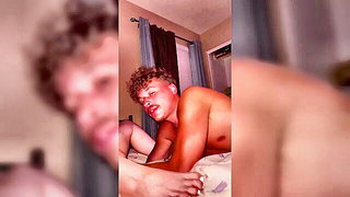 Couple mid-scene in a dim bedroom