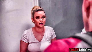 Couple mid-scene in a dim bedroom