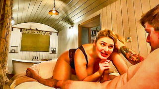 Explicit doggy style scene on a wide bed