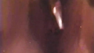 Explicit massage scene in a softly lit room