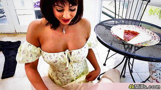 Amateur couple on a living room sofa in explicit scene