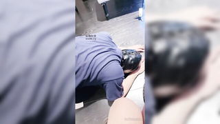 Couple on a made bed in an explicit scene