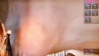 Explicit massage scene in a softly lit room