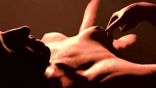 Amateur couple on a living room sofa in explicit scene