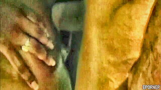 Amateur couple on a living room sofa in explicit scene